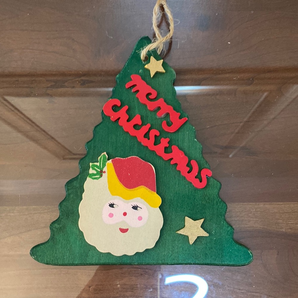 Merry Christmas wooden ornament From Concepts Intl.